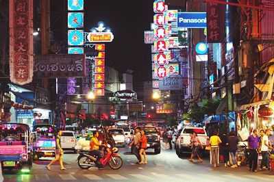 Illuminated city street at night