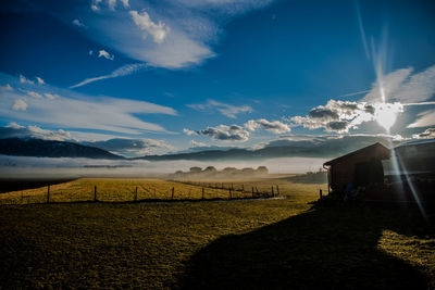 Scenic view of field against sky during sunset