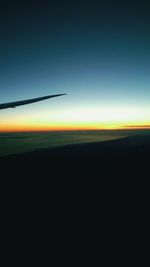 Scenic view of silhouette landscape against clear sky during sunset