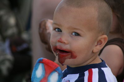 Close-up portrait of smiling boy at home