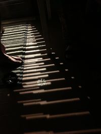 High angle view of person playing piano