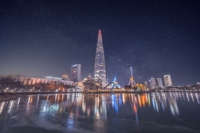 Illuminated buildings in city at night