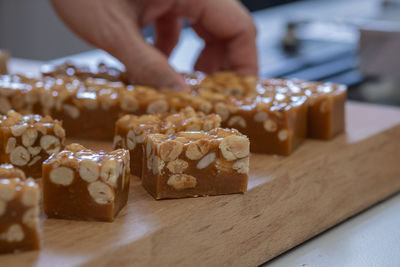 Close-up of person preparing food on cutting board