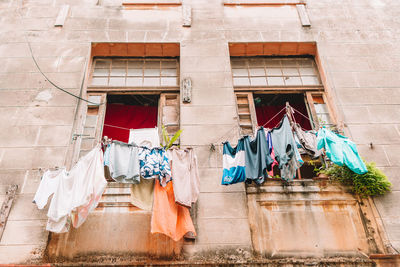 Low angle view of clothes drying outside building