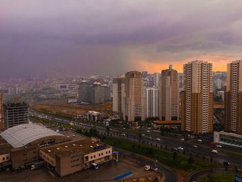 High angle view of buildings against sky during sunset