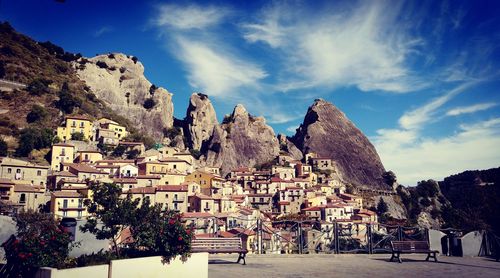 Panoramic view of trees and mountains against sky