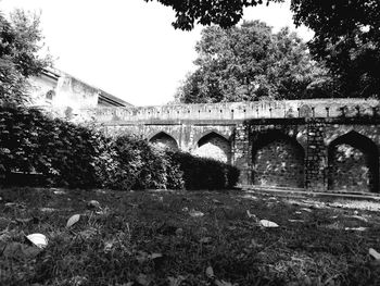 Low angle view of arch bridge against sky