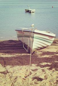 Boat moored on shore