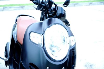 Close-up of vintage car on road