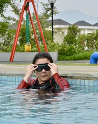 Portrait of man in swimming pool