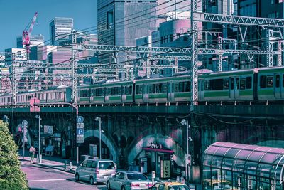 Train on bridge in city