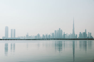 Modern buildings in city against clear sky