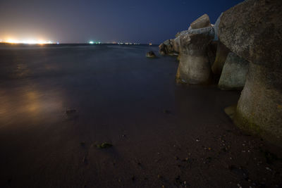 Scenic view of sea against sky at night