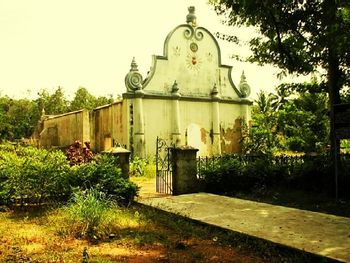 Built structure in garden against building