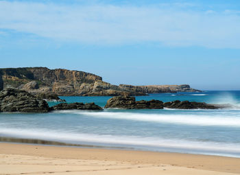 Scenic view of beach against sky