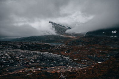 Aerial view of snowcapped mountains against sky
