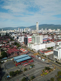 High angle view of city buildings against sky