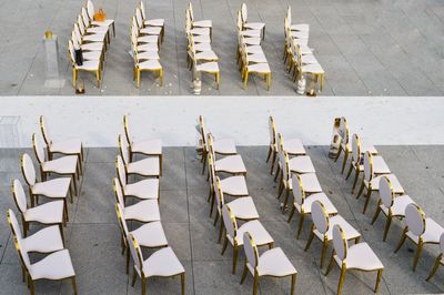 High angle view of chairs on street