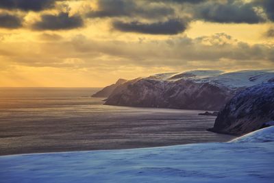 Scenic view of sea against cloudy sky