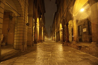 Empty illuminated street at night