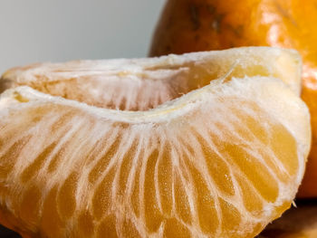 Close-up of lemon on table against white background