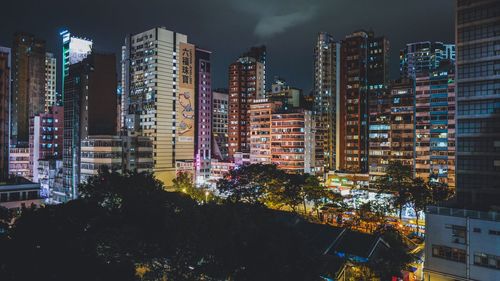 Low angle view of illuminated cityscape at night