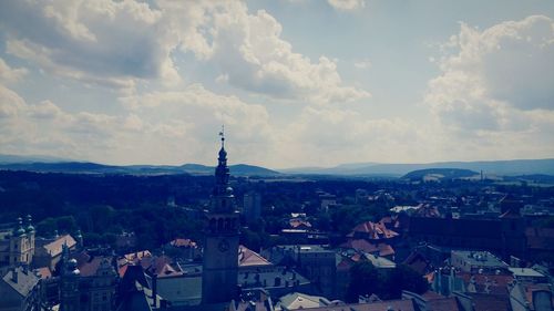 View of town against cloudy sky