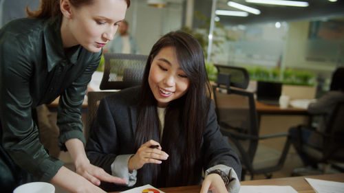 Businesswomen having discussion at office