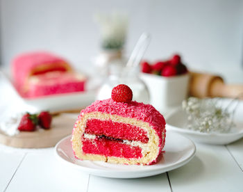 Close-up of strawberry cake in plate on table