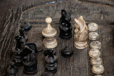 High angle view of chess pieces on board