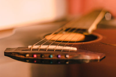 Close-up of guitar on table
