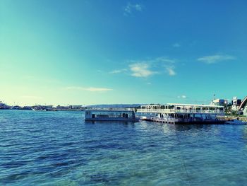 Scenic view of sea against blue sky