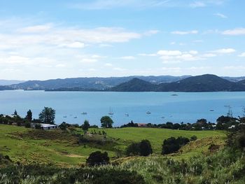 Scenic view of lake and mountains against sky