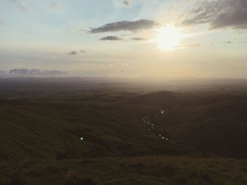 Scenic view of landscape against sky during sunset