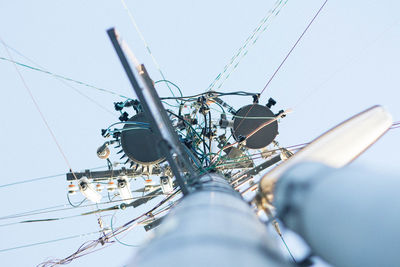 Directly below shot of communications tower against clear sky