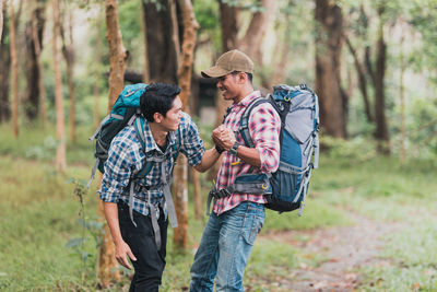 Young couple kissing in forest