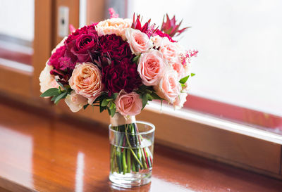 Midsection of woman with flowers