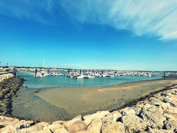 Scenic view of beach against blue sky