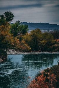 Scenic view of lake against sky during autumn