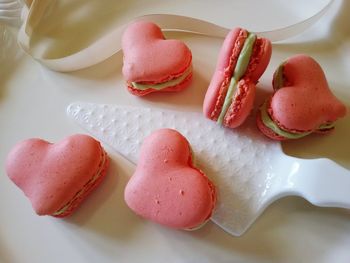 High angle view of heart shape macroons on table