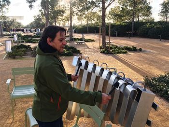 Side view of mature man exercising in park