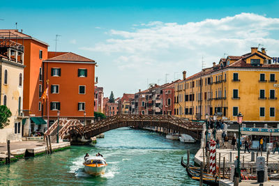 Grand canal amidst buildings against sky