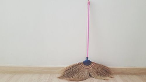 Broom by wall