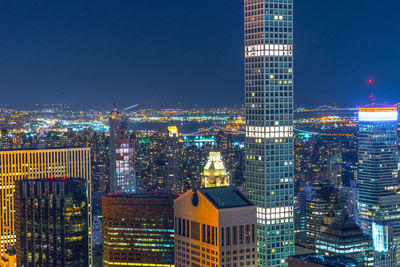 Illuminated buildings in city at night