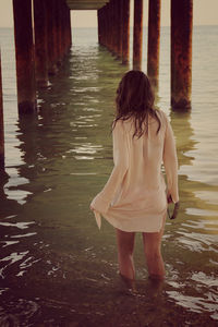 Woman standing in water