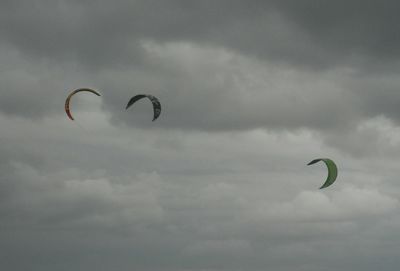 Low angle view of kite flying against sky