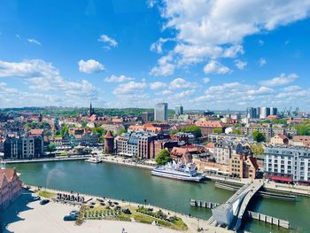 High angle view of buildings in city against sky