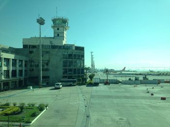 View of buildings against clear blue sky