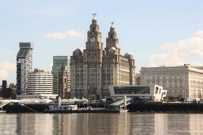 Buildings in city against sky