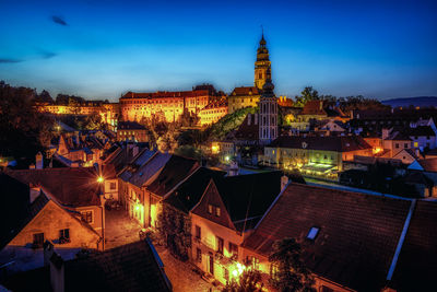 High angle view of illuminated buildings in city at night